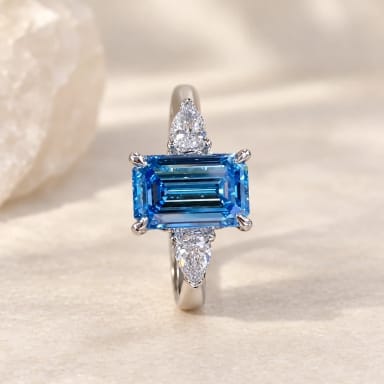 1.5ct Emerald Cut Blue Diamond Three-Stone Engagement Ring in 18K White Gold